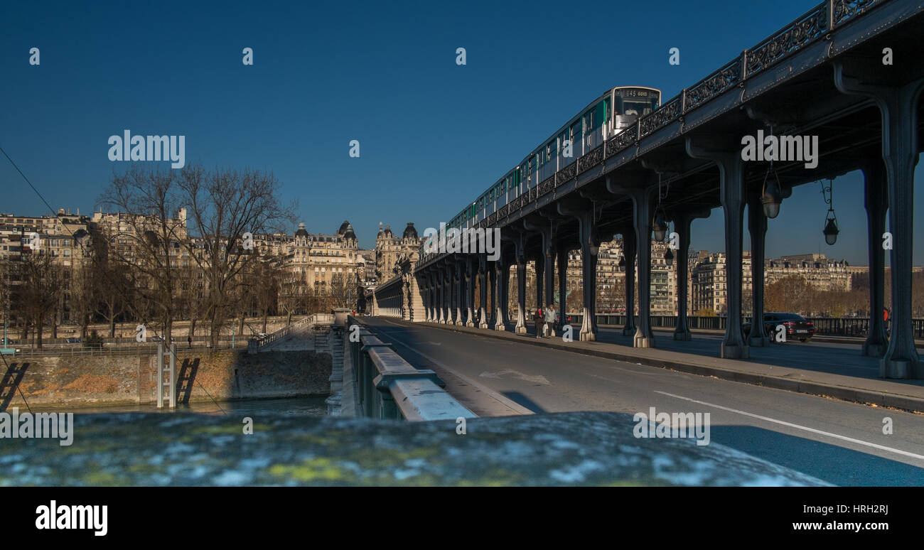 Paris Metro train crossed Pont de Bir-Hakeim, clear blue sky Stock Photo