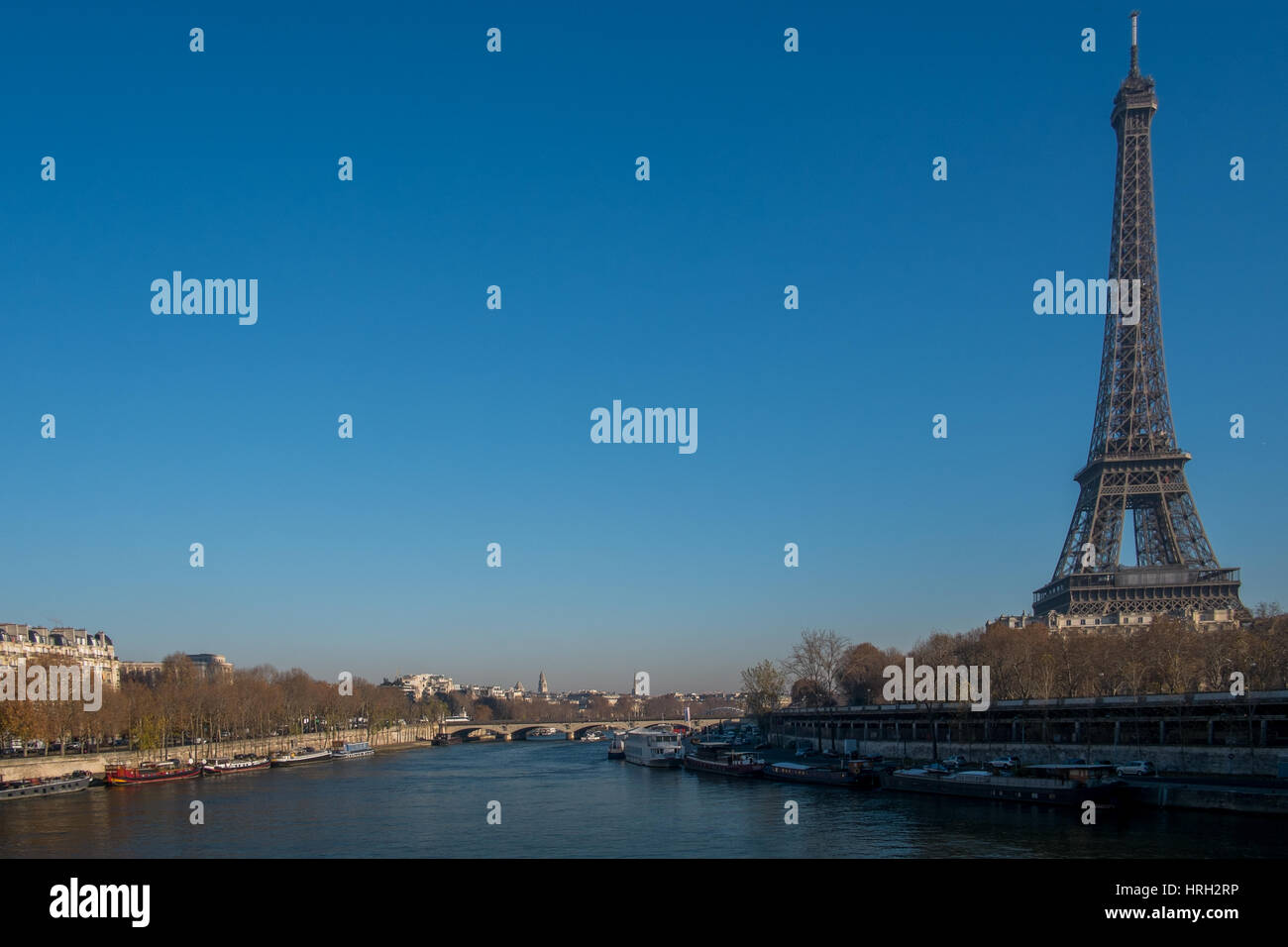 The Eiffel Tower stands majestically against a clear blue sky on the