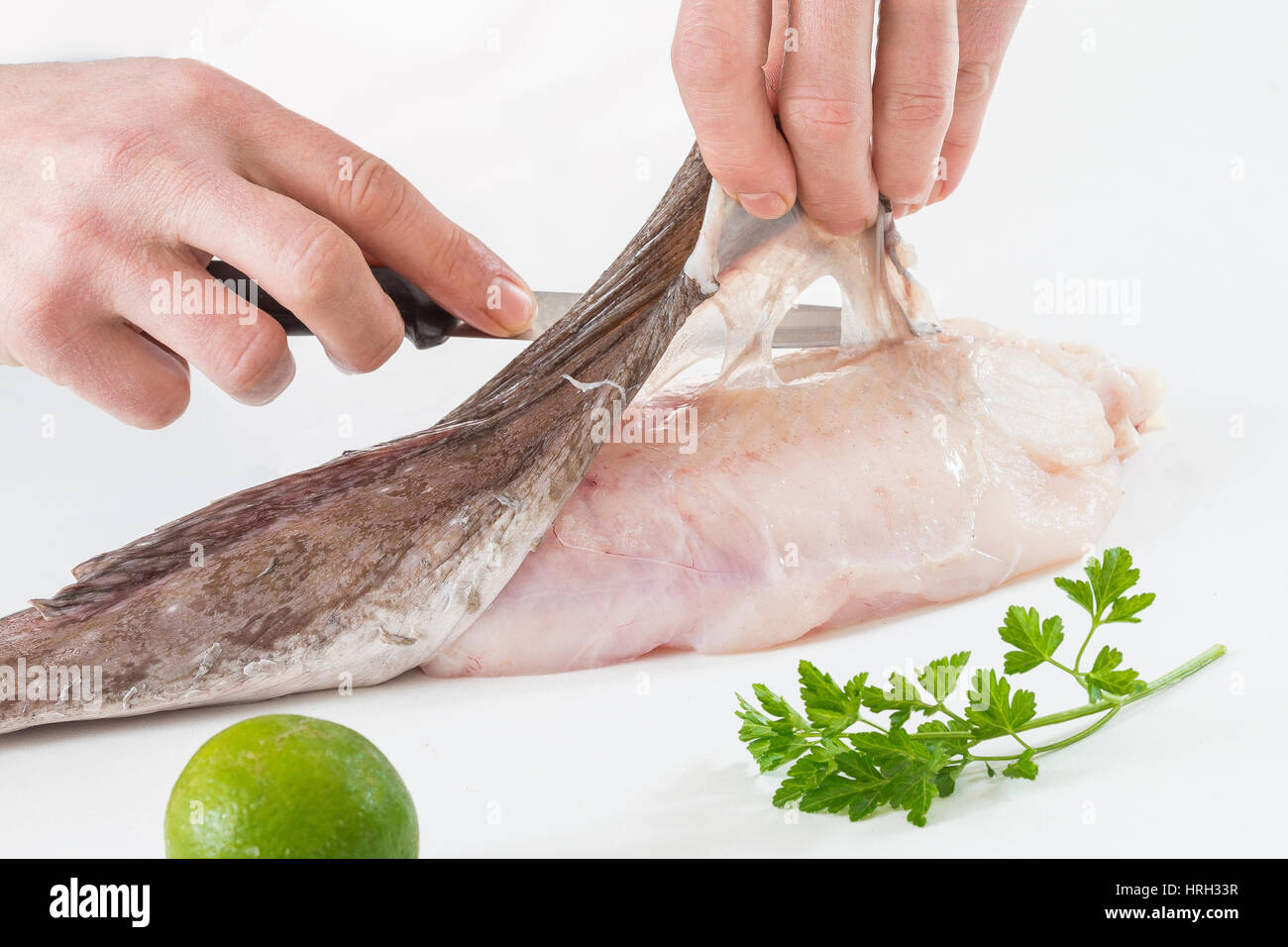some monkfish slices on a white background Stock Photo