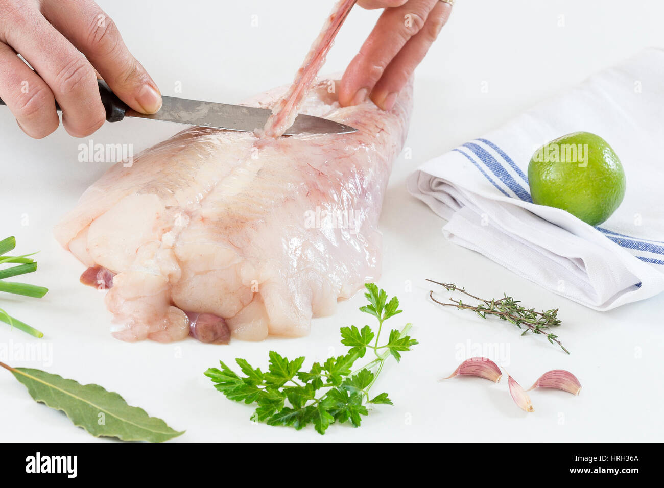 some monkfish slices on a white background Stock Photo