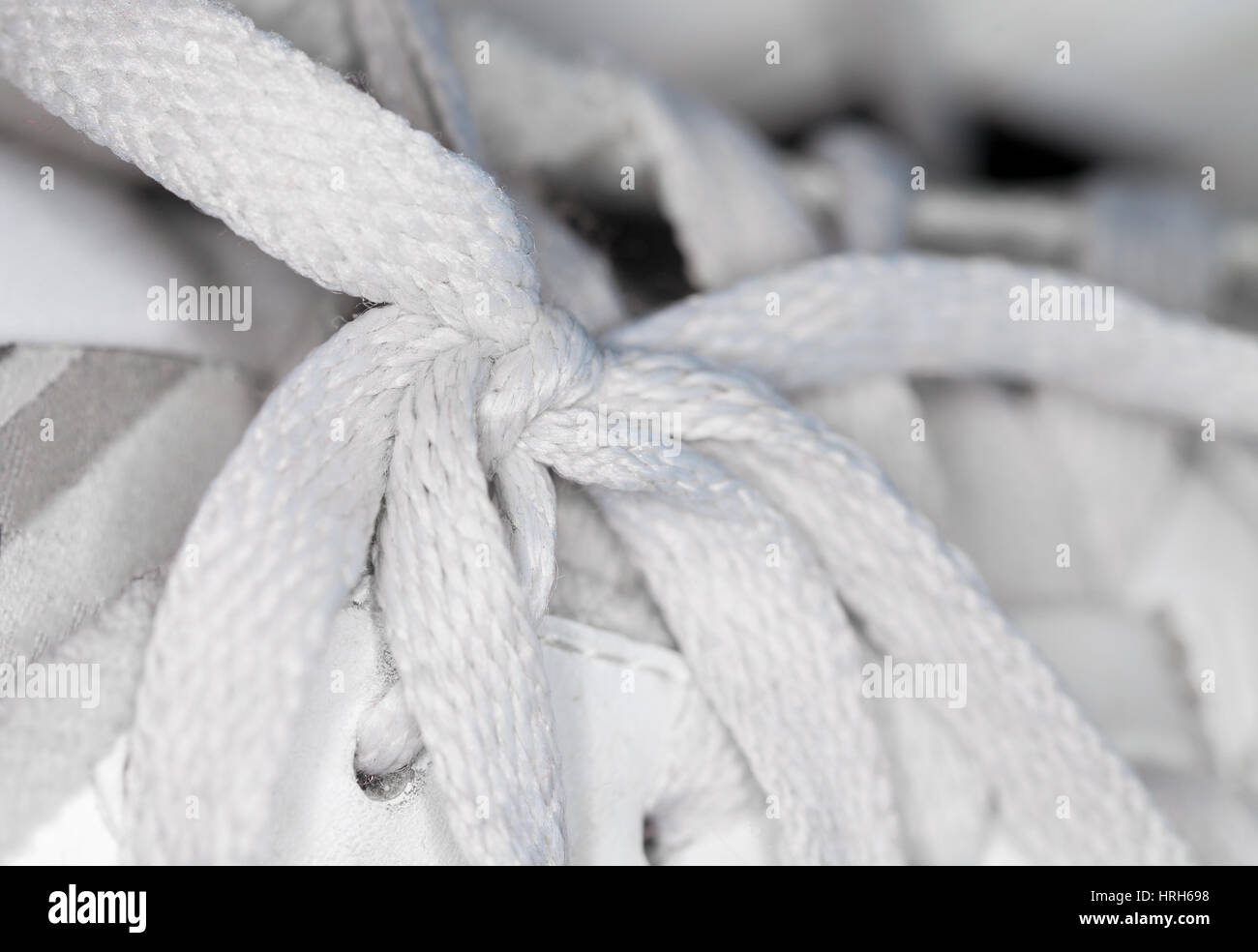 white shoelace knot on white gym shoes Stock Photo