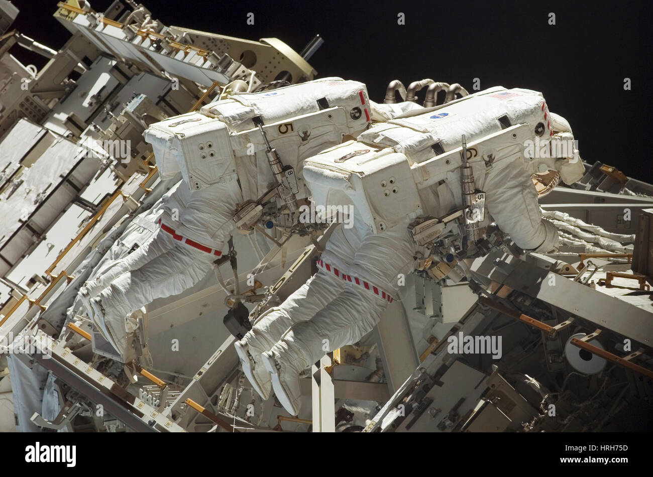 Atlantis astronauts on spacewalk Stock Photo