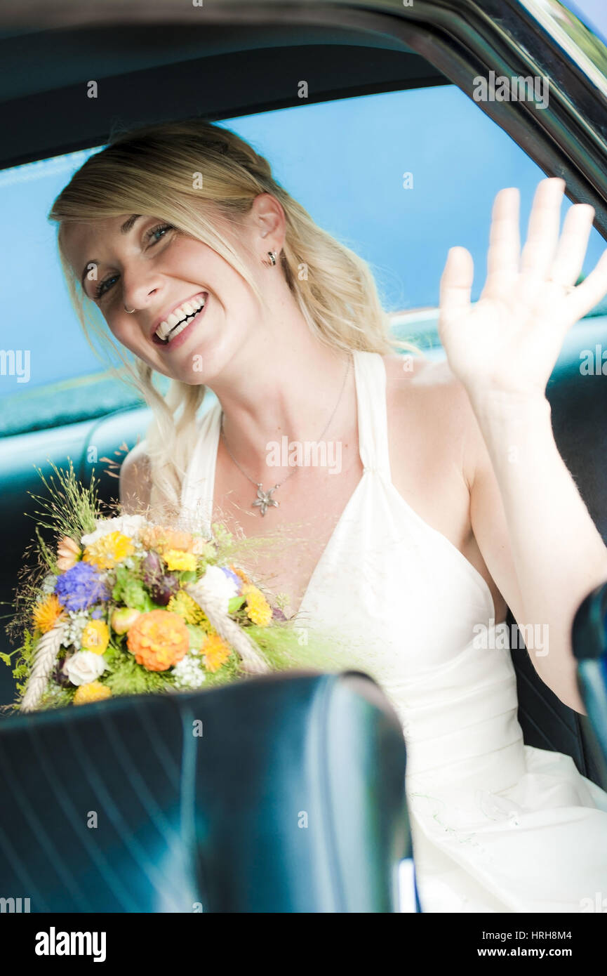 Model released, Braut im Brautauto - bride in wedding car Stock Photo