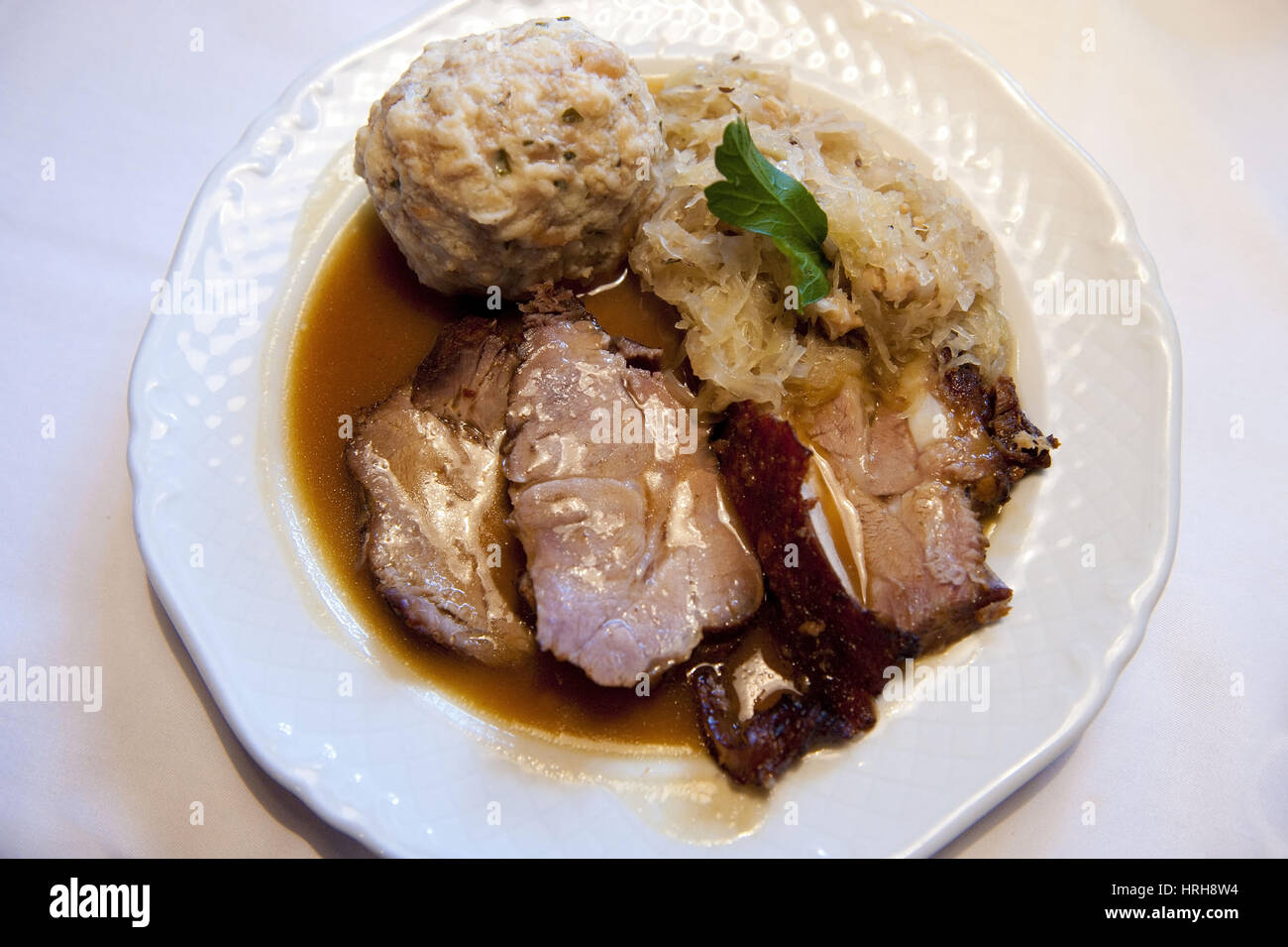 Schweinsbraten mit Semmelknoedel und Sauerkraut roast pork with bread