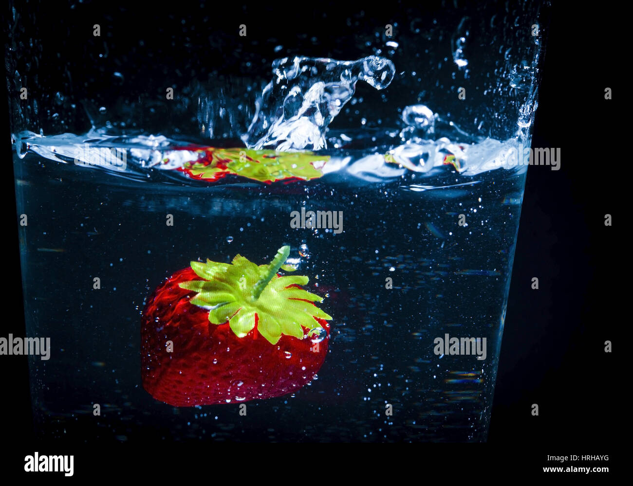 Erdbeere im Wasserglas - strawberry in a glass of water Stock Photo