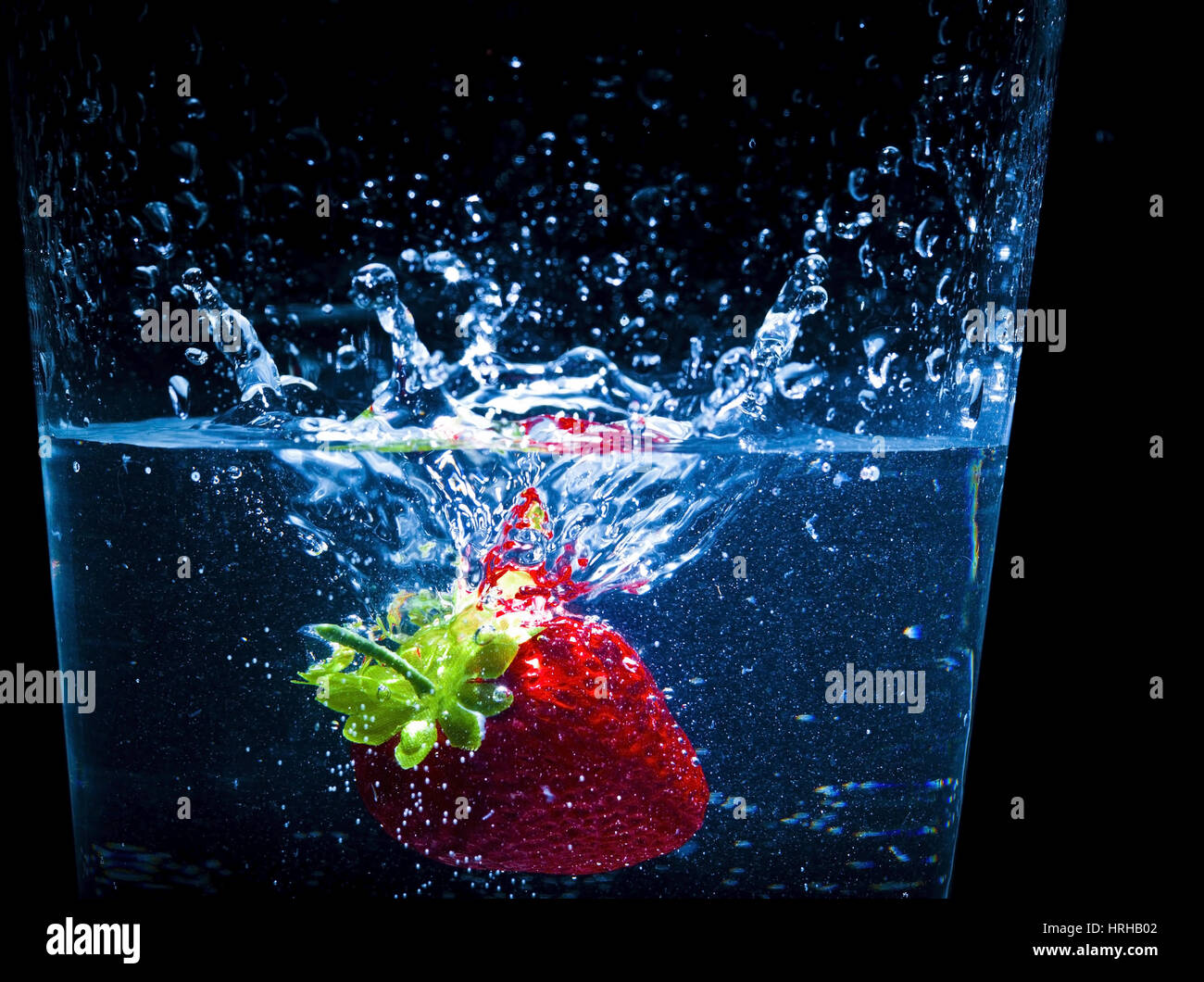 Erdbeere im Wasserglas - strawberry in a glass of water Stock Photo