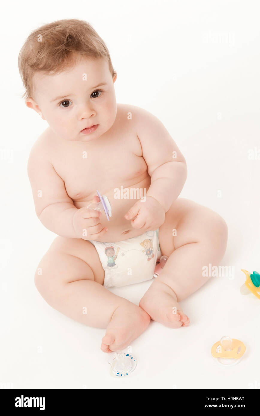 Model released, Baby in Windeln mit Schnullern - baby with dummies Stock Photo