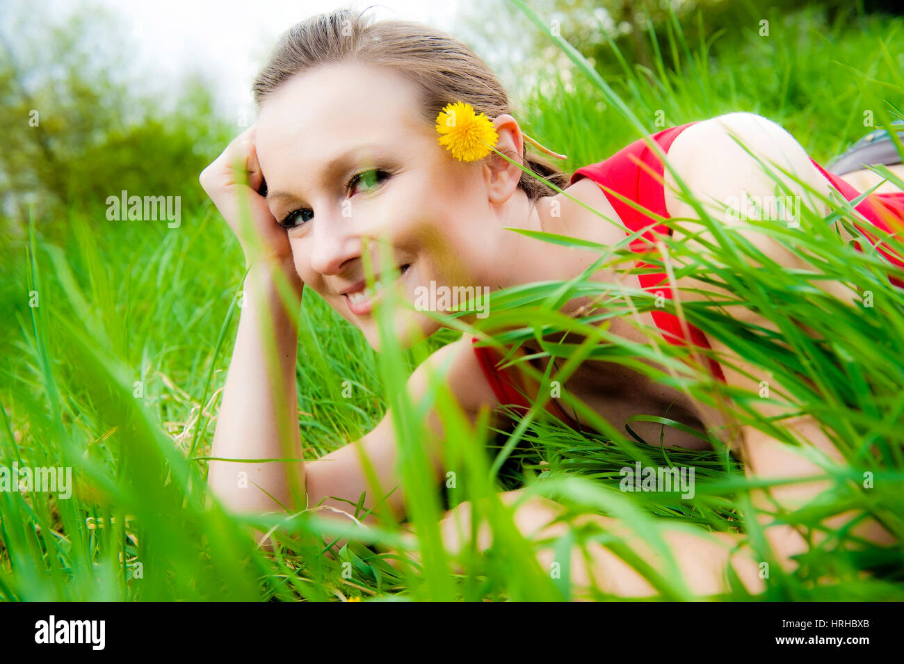 Model released, Junge Frau in Fruehlingswiese - woman in spring meadow Stock Photo