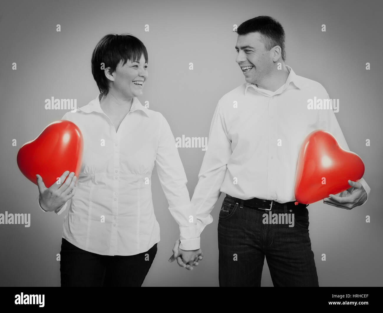 Paar mit Herzluftballonen - couple with heart balloons Stock Photo