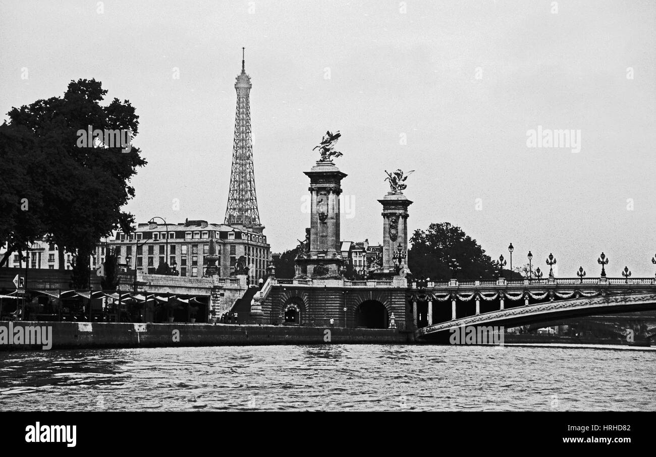 Eiffel Tower in Paris from the River Seine in black and white with the contrast kicked up for a stark image. Stock Photo