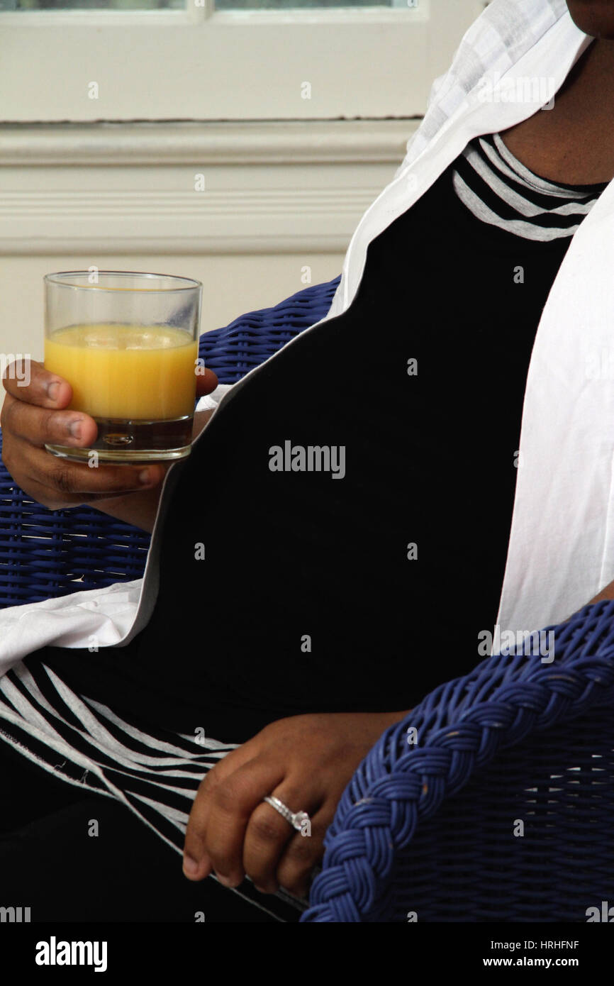 Pregnant Woman Drinking Orange Juice Stock Photo Alamy