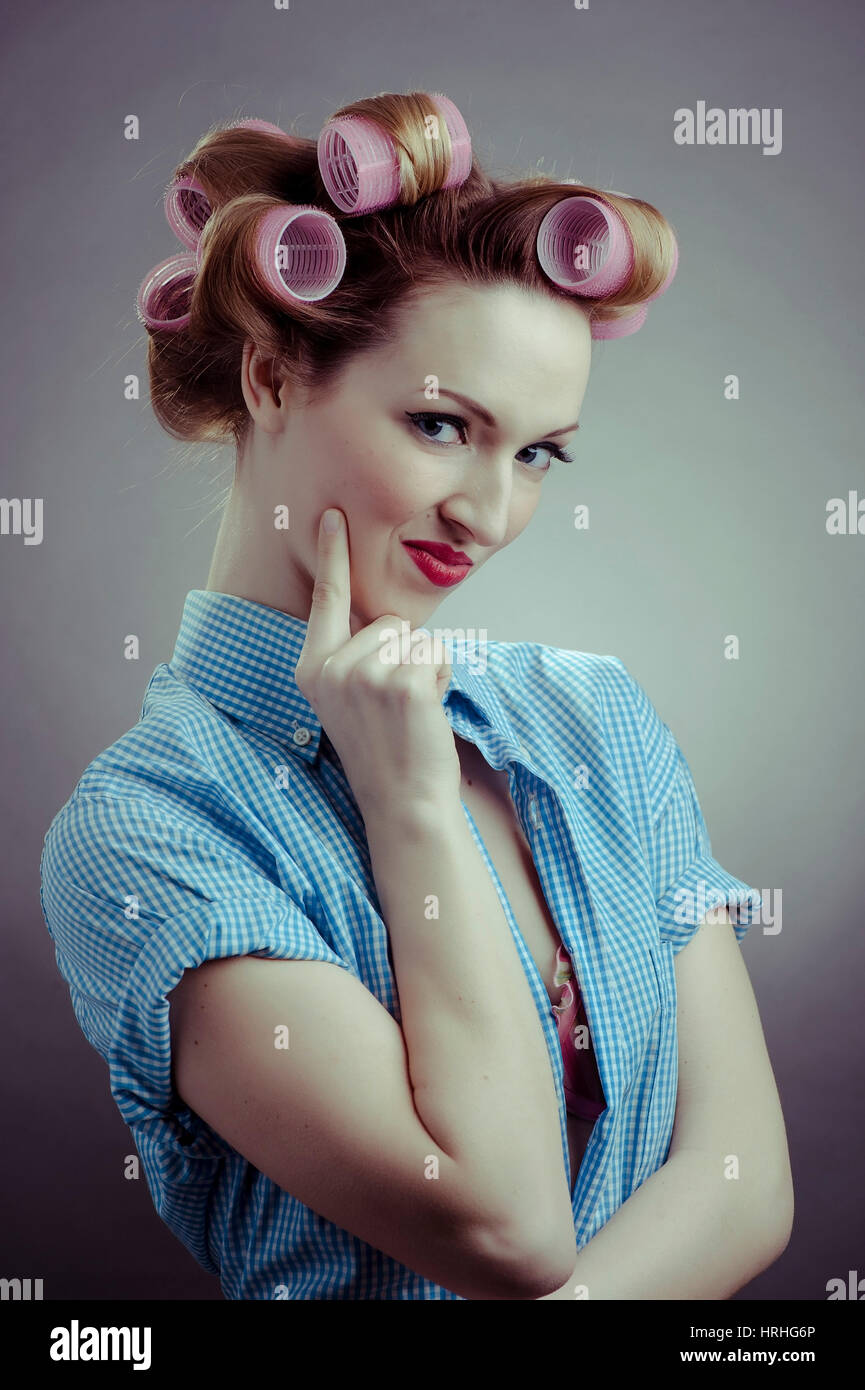 Junge Frau mit Lockenwicklern, Pin-Up - young woman with hair roller Stock Photo