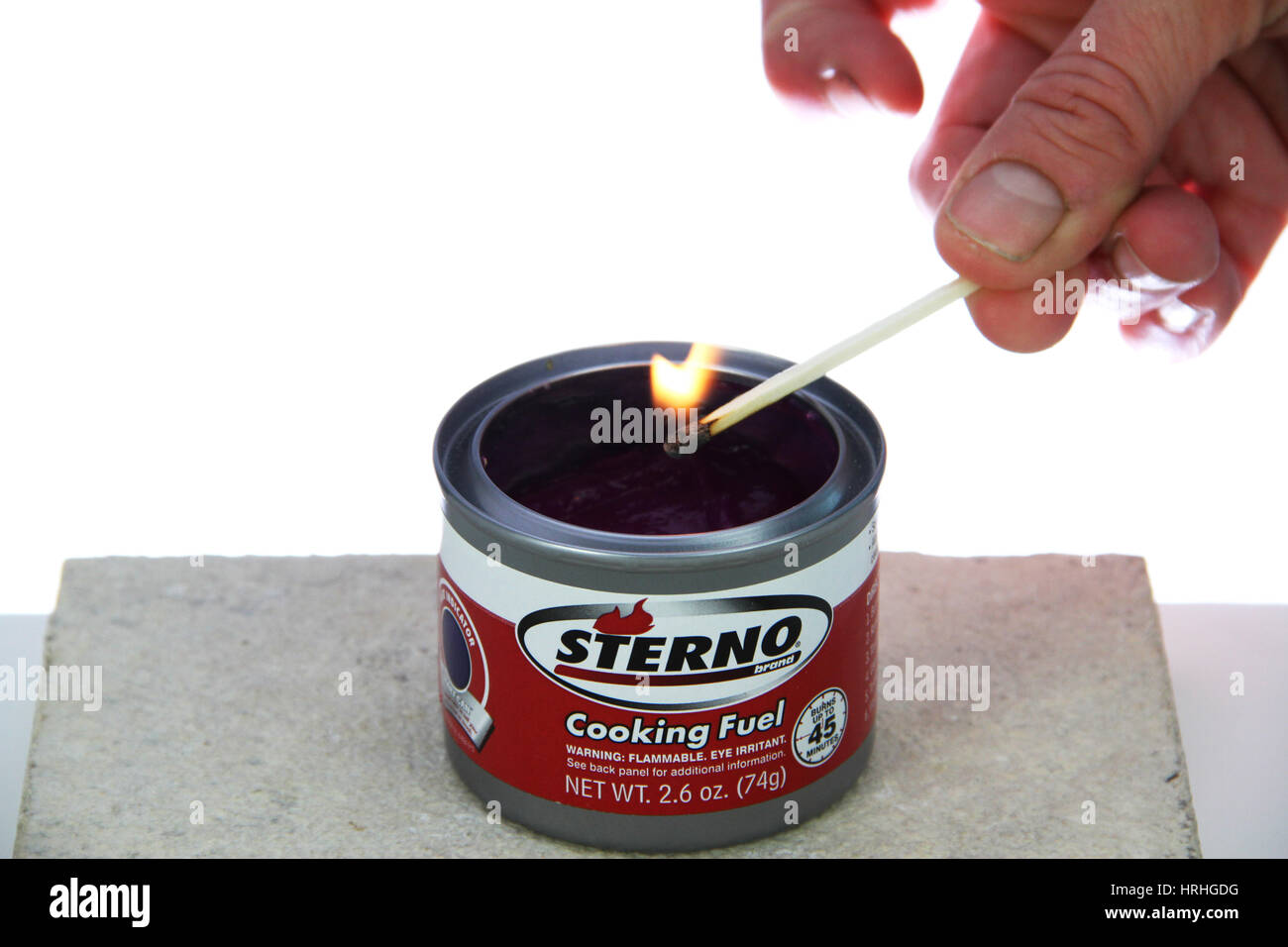 Lighting a can of Sterno Stock Photo