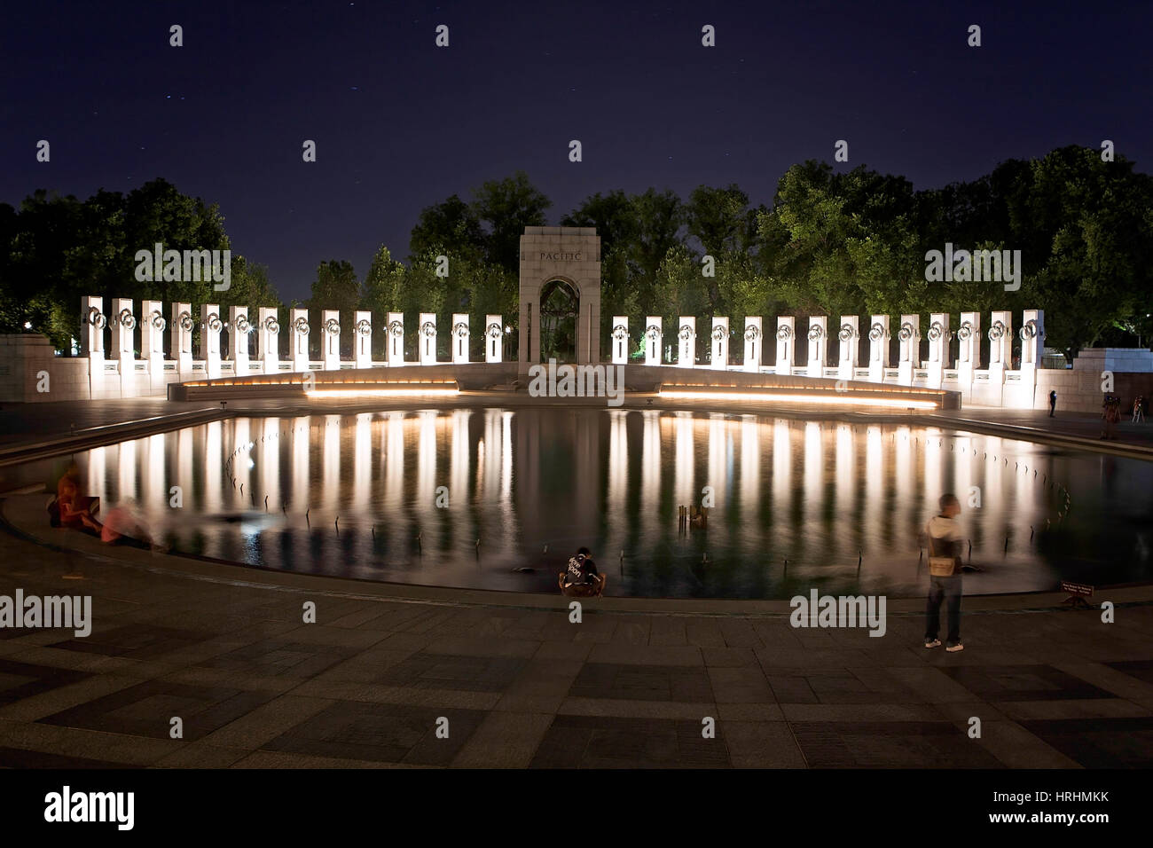 Tourists at the World War Two Memorial on the National Mall in Washington, D.C. on a June night in 2014. Stock Photo