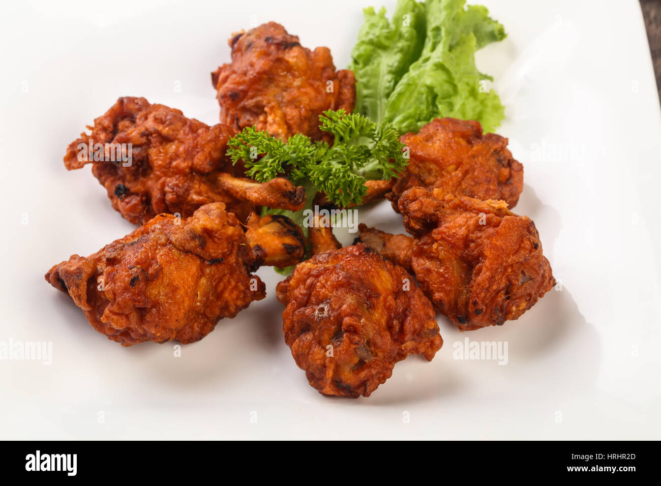 Indian traditional cuisine Chicken lollipops with spices Stock Photo