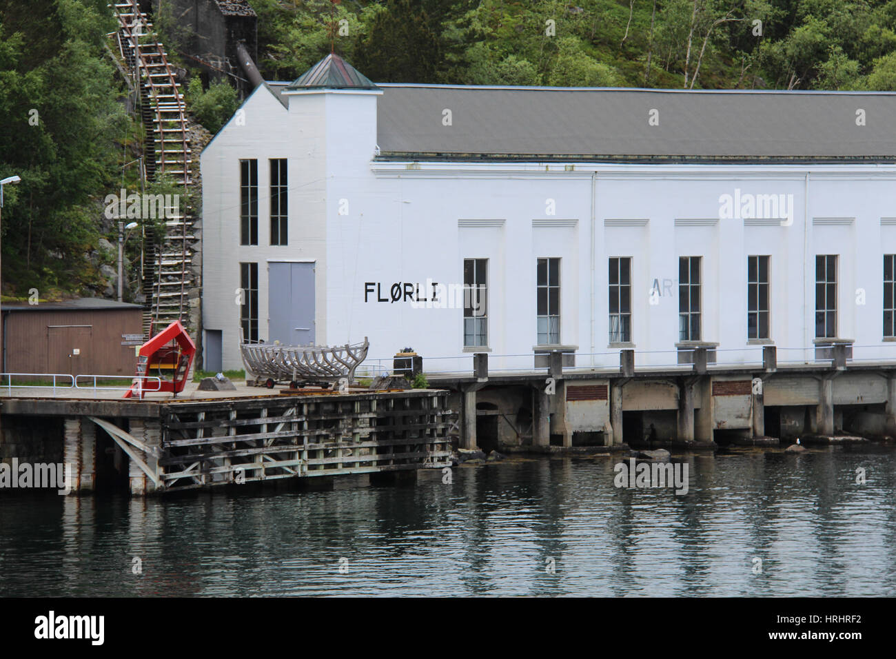View on the Flørli building seen from a ferry on the Lysefjord. This old powerstation is now a touristic attraction with the worlds longest stairway Stock Photo
