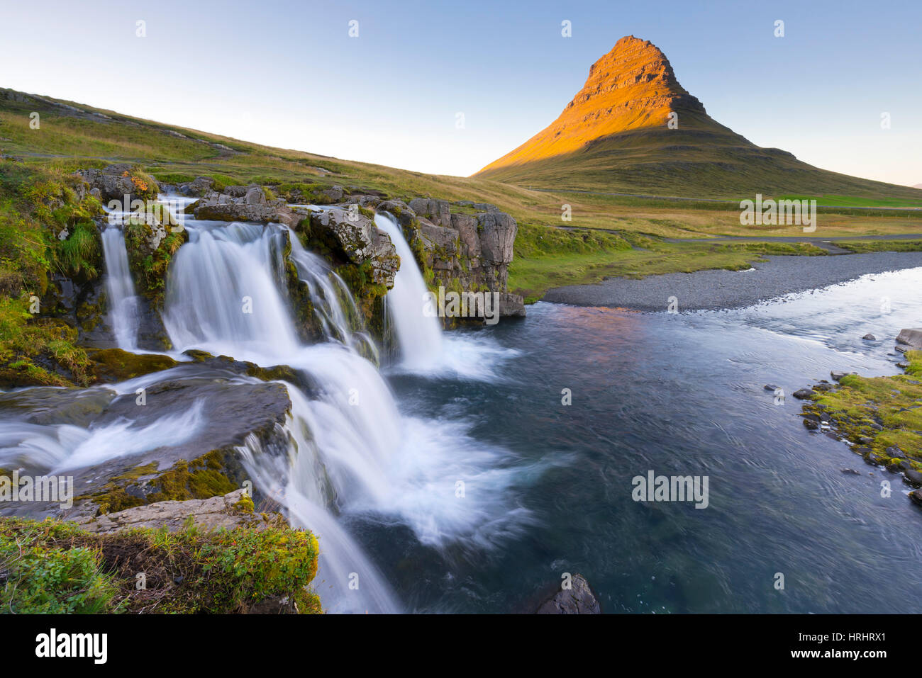 Kirkjufell Mountain and Kirkjufoss Waterfall at sunset, Snaefellsnes Peninsula, Iceland, Polar Regions Stock Photo