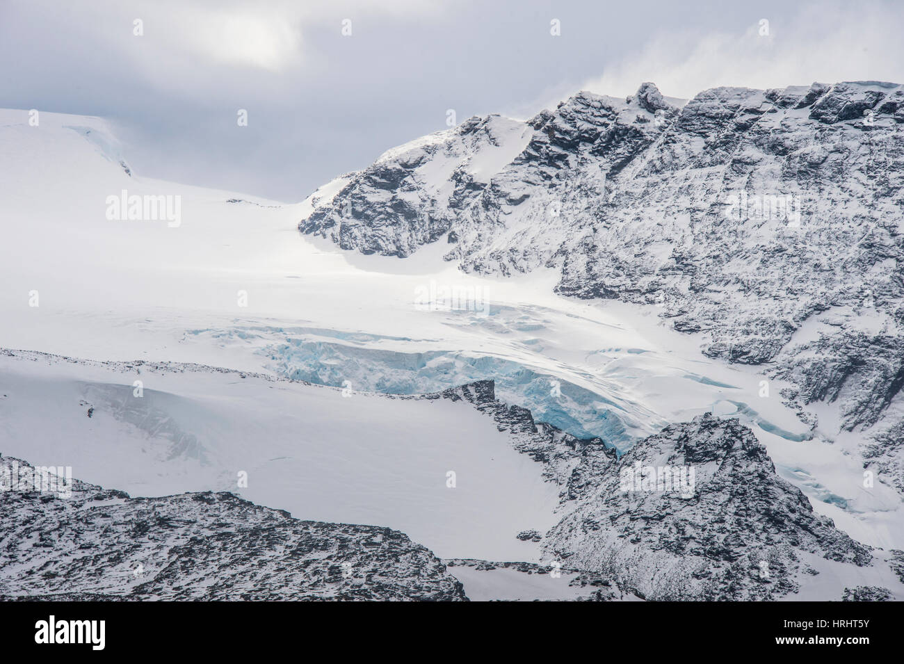 Glacier flowing down a mountain on Elephant Island, South Shetland Islands, Antarctica, Polar Regions Stock Photo