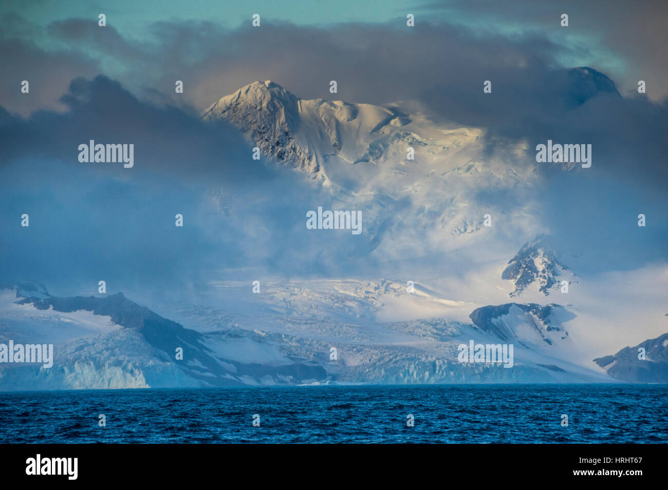 Mountain breaking through the clouds, Elephant Island, South Shetland Islands, Antarctica, Polar Regions Stock Photo