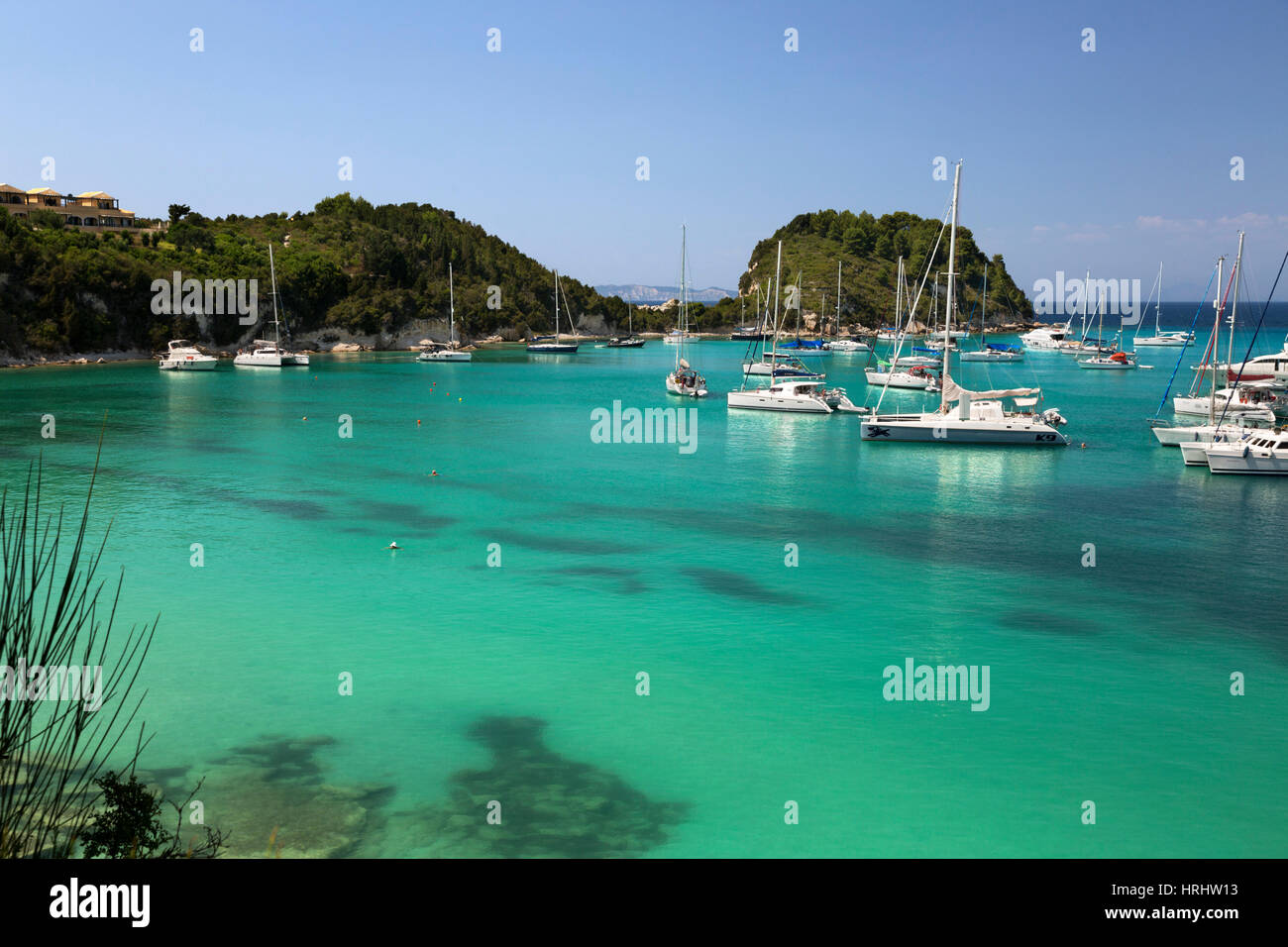 Yachts anchored in bay, Lakka, Paxos, Ionian Islands, Greek Islands, Greece Stock Photo