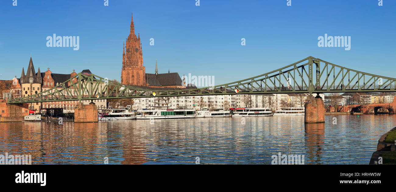 View over Main River to Eiserner Steg iron footbridge and Kaiserdom Cathedral of St. Bartholomew, Frankfurt, Hesse, Germany Stock Photo