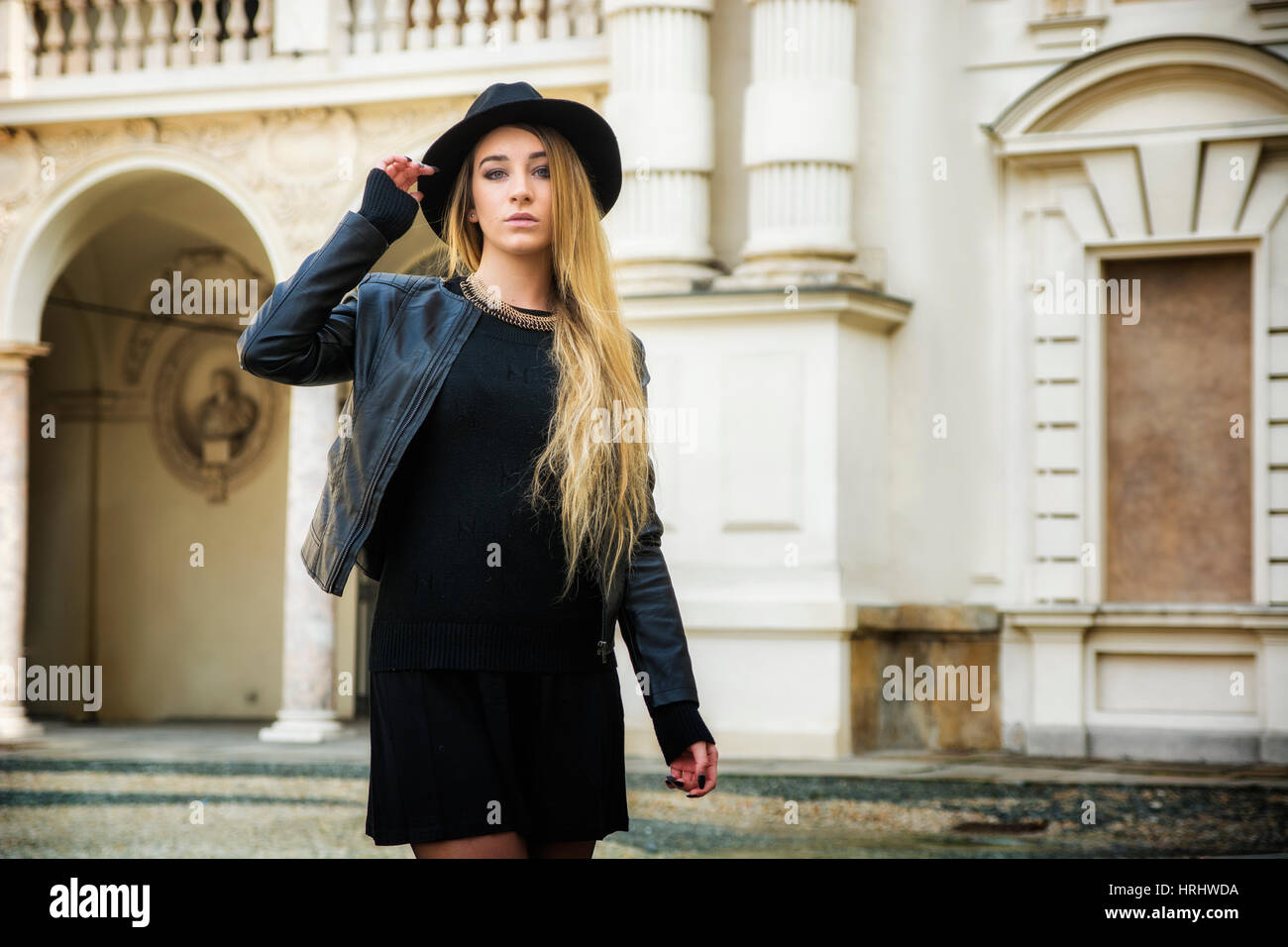 Beautiful young woman in black hat Stock Photo - Alamy