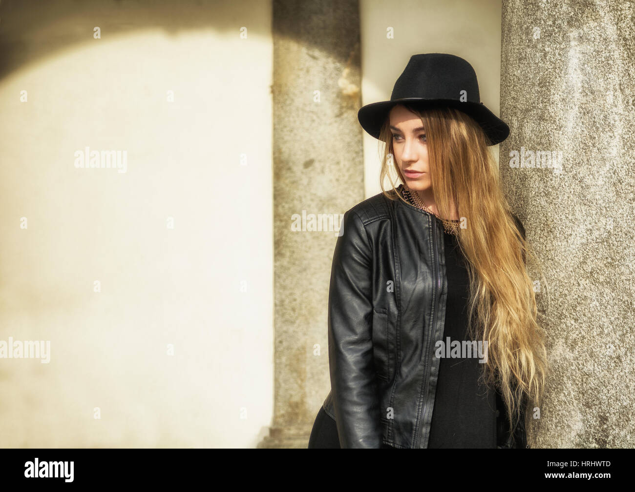 Beautiful young woman in black hat Stock Photo - Alamy