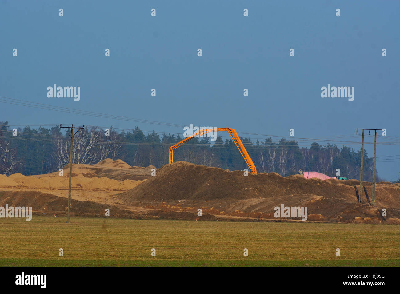 concrete pump while working at a construction site Stock Photo