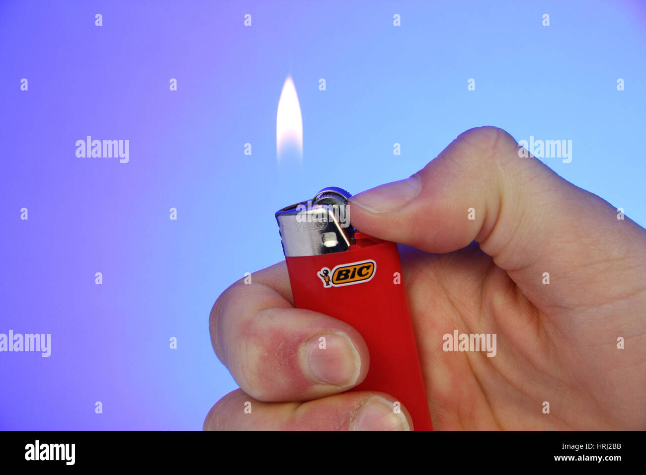 Lit cigarette lighter Stock Photo - Alamy