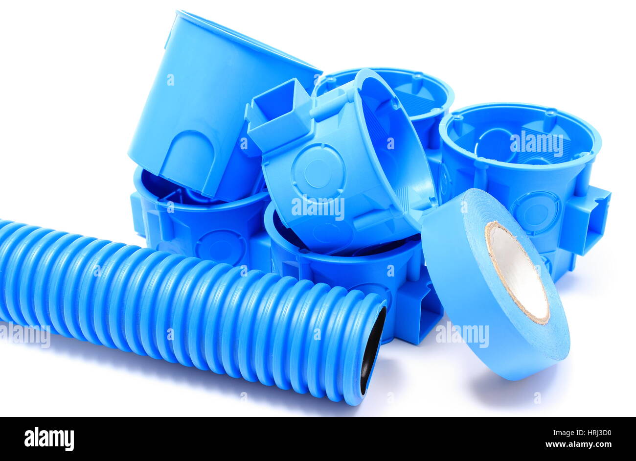 Heap of blue electrical boxes and components for use in electrical