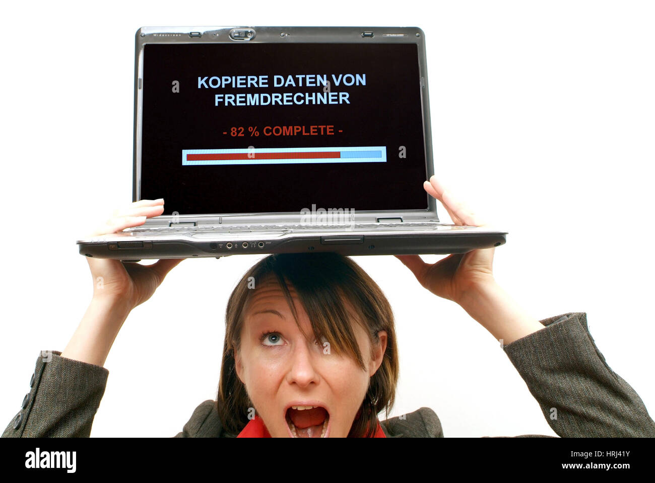 Gesch?ftsfrau mit Laptop am Kopf, Symbolbild Kopiere Daten von Fremdrechner, Datenklau - business woman with laptop on head, symbolic for data steal Stock Photo