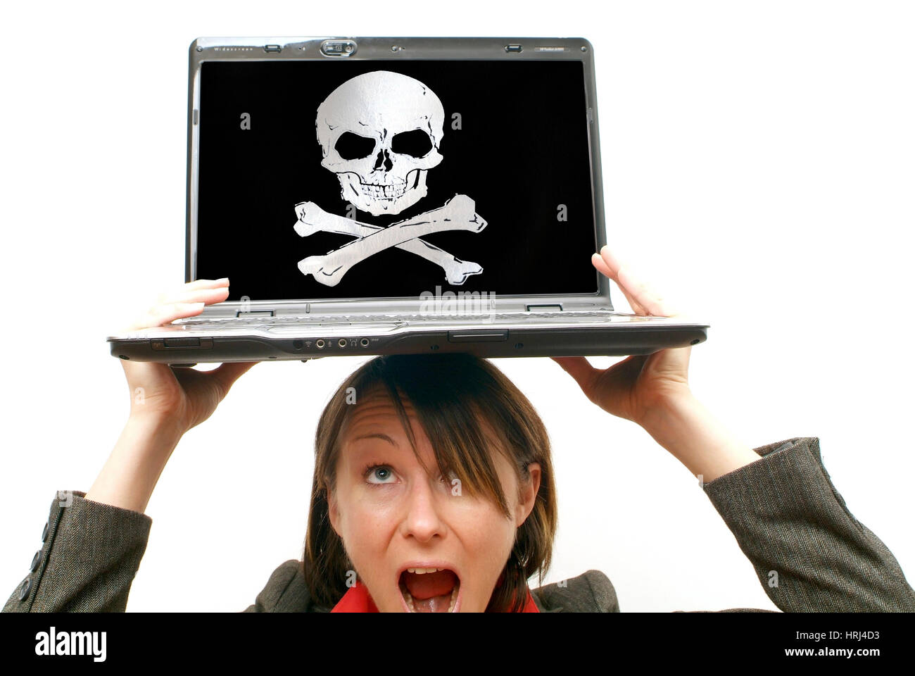Gesch?ftsfrau mit Laptop am Kopf, Symbolbild Totenkopf, Gefahr - business woman with laptop on head, symbolic death's head Stock Photo