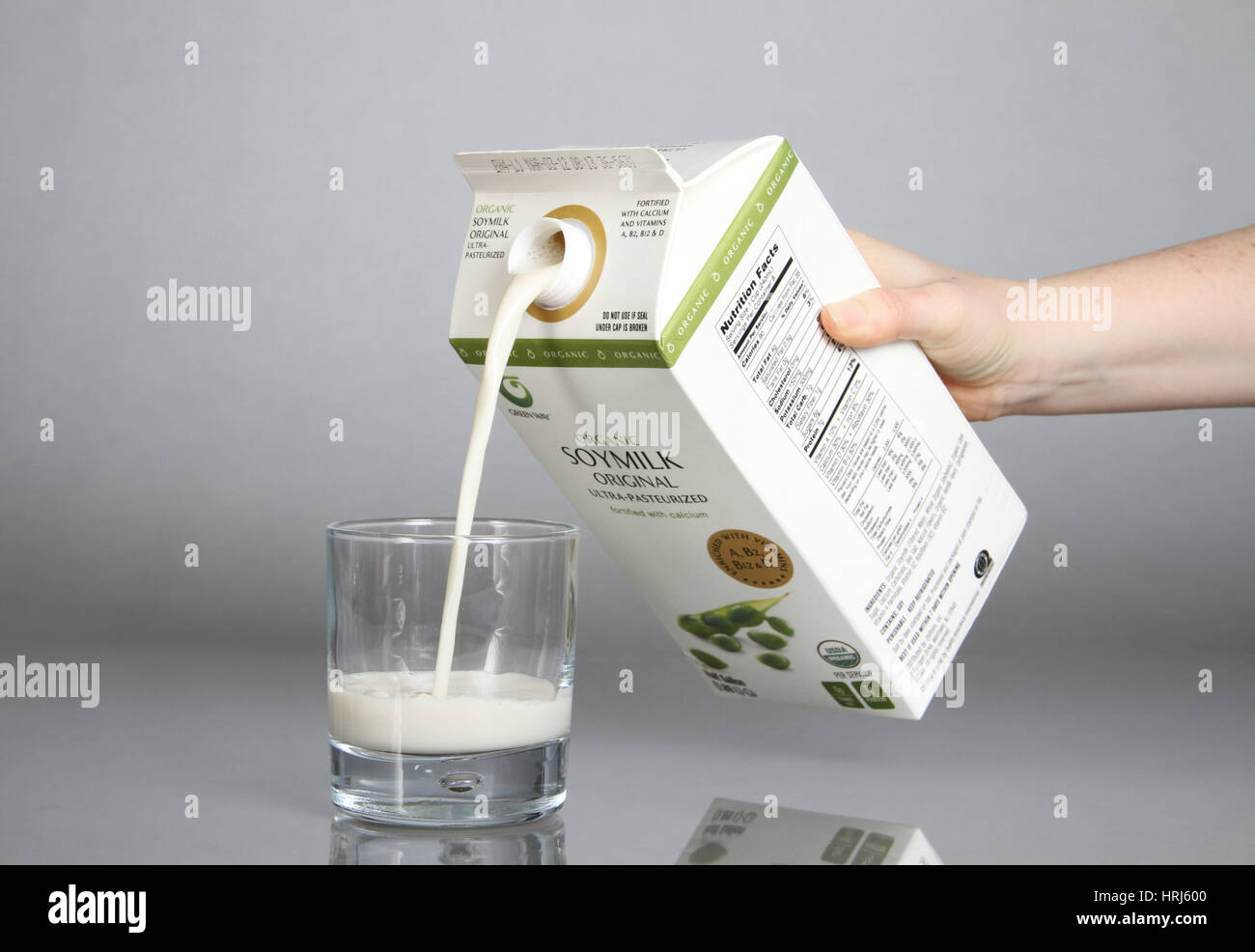 Organic Soy Milk Being Poured into a Glass Stock Photo Alamy
