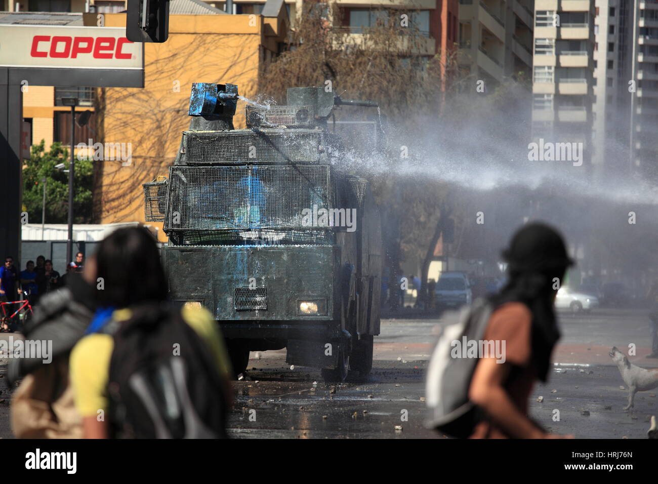 Chilean police water cannon disperse protesters,during a student strike in Santiago's Downtown, Chile. Stock Photo