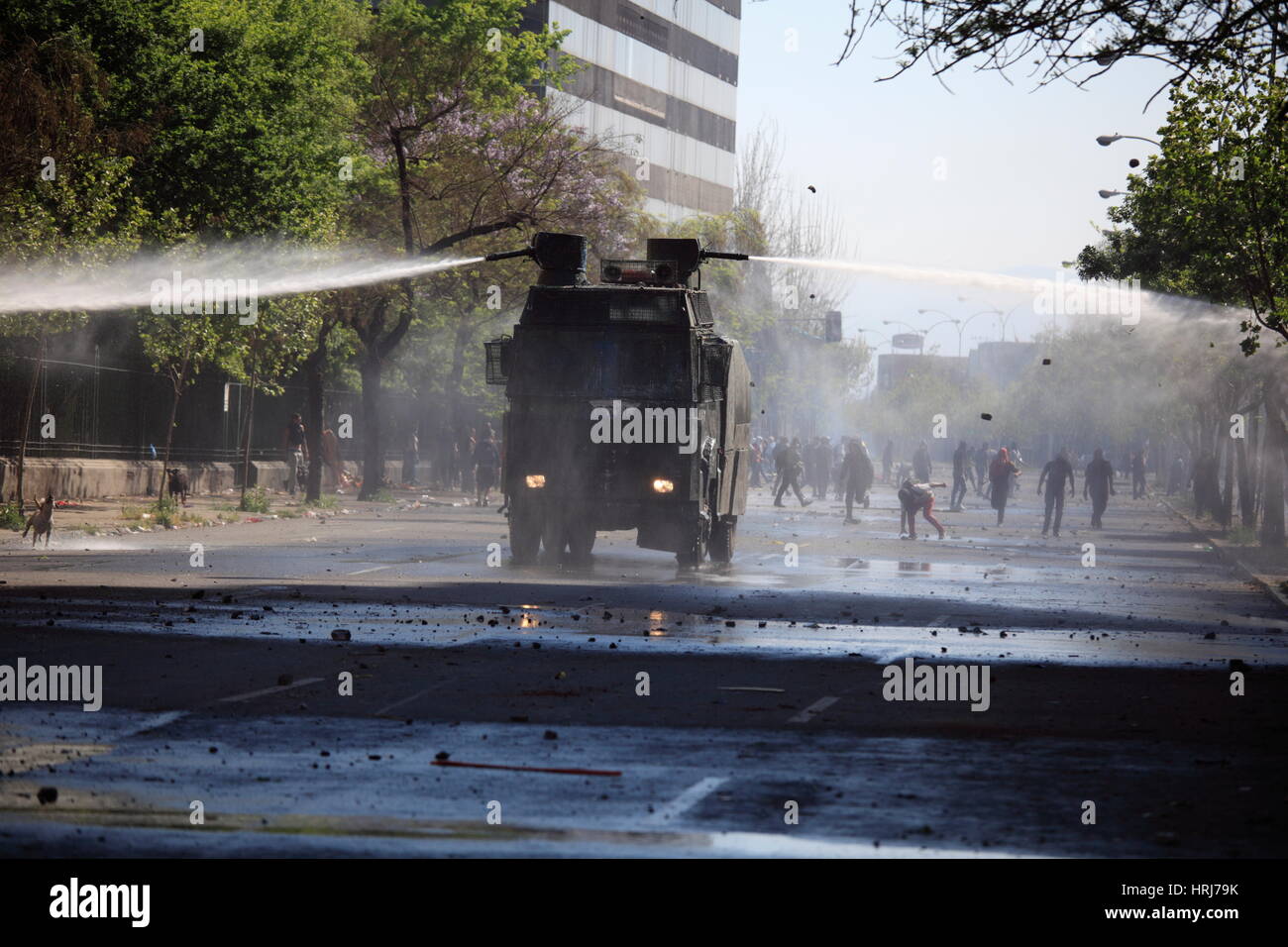 Chilean police water cannon disperse protesters,during a student strike in Santiago's Downtown, Chile. Stock Photo