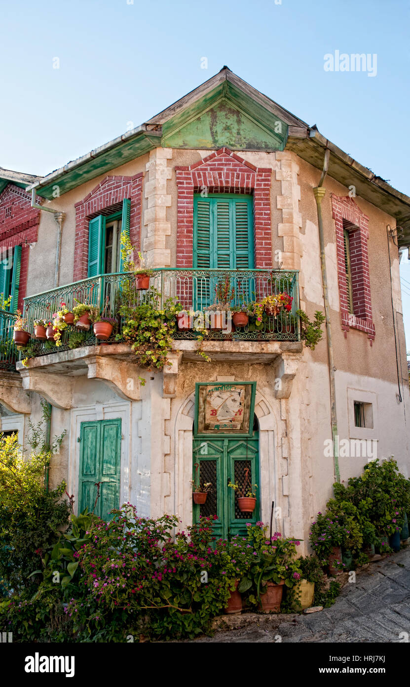 Old vintage house decorated with colorful plants in pots Stock Photo - Alamy