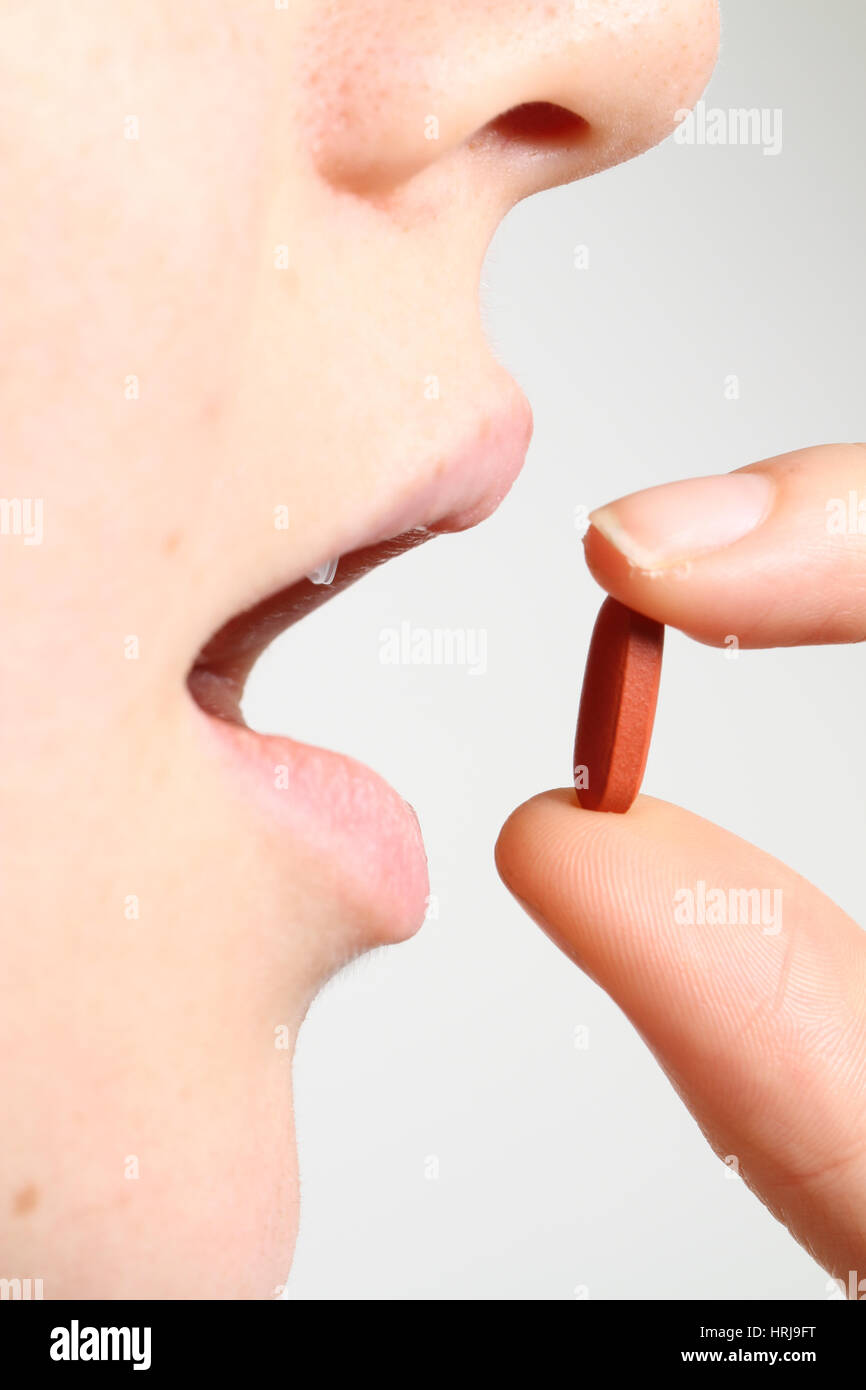 Woman taking Ibuprofen Stock Photo Alamy
