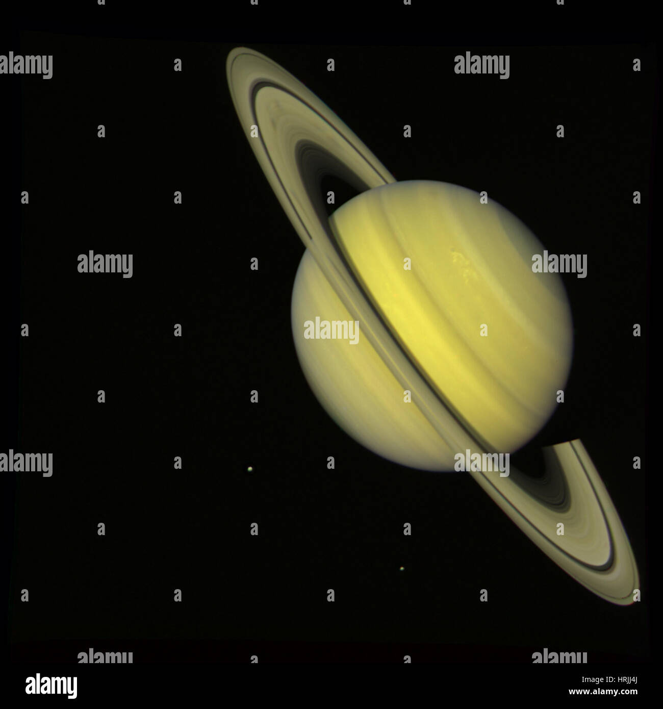 Saturn with Rhea and Dione, Voyager 2 Stock Photo