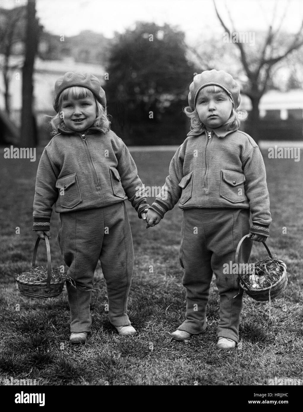 Twin Sisters with Easter Baskets, 1931 Stock Photo