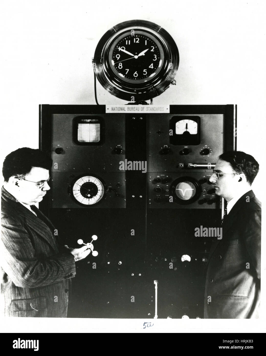 Edward Condon with First Atomic Clock Stock Photo
