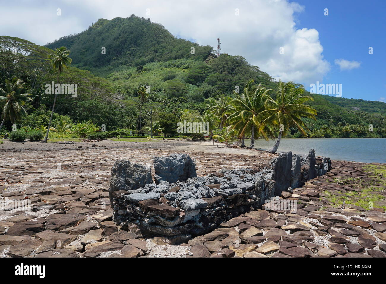 French Polynesia marae old stone structure on the shore of the lake Fauna Nui, Maeva, Huahine Nui island Stock Photo