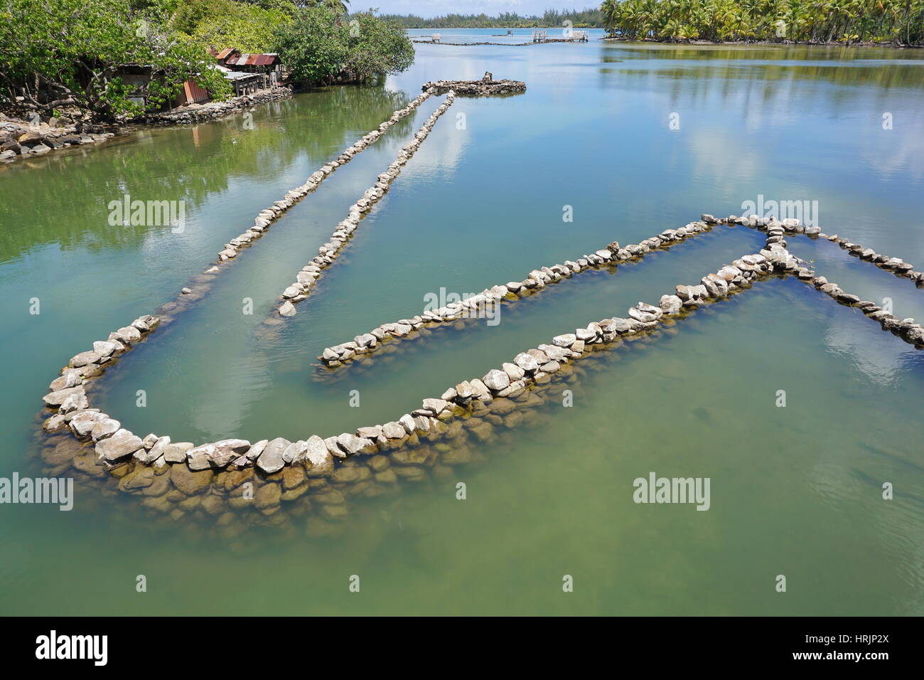 Traditional Polynesian old fish trap made with stones, Huahine island, South Pacific, French Polynesia Stock Photo