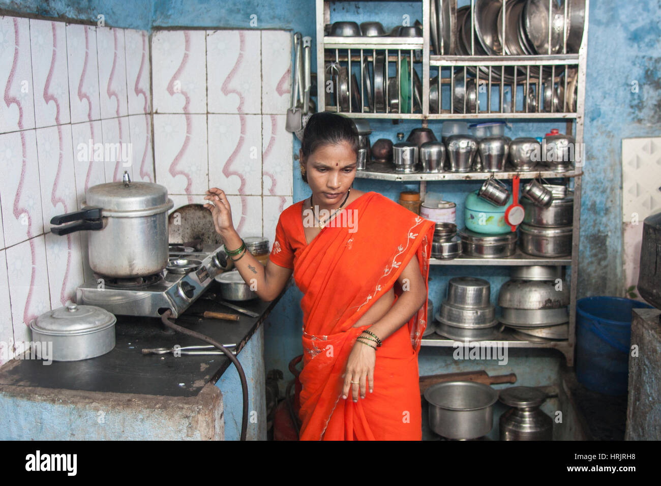 Poor,Family,in,basic,simple,kitchen,in,largest,slum,Dharavi,in,Asia