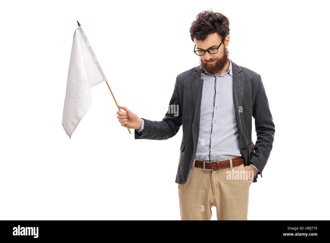 Man with his head down holding a white flag isolated on white background Stock Photo