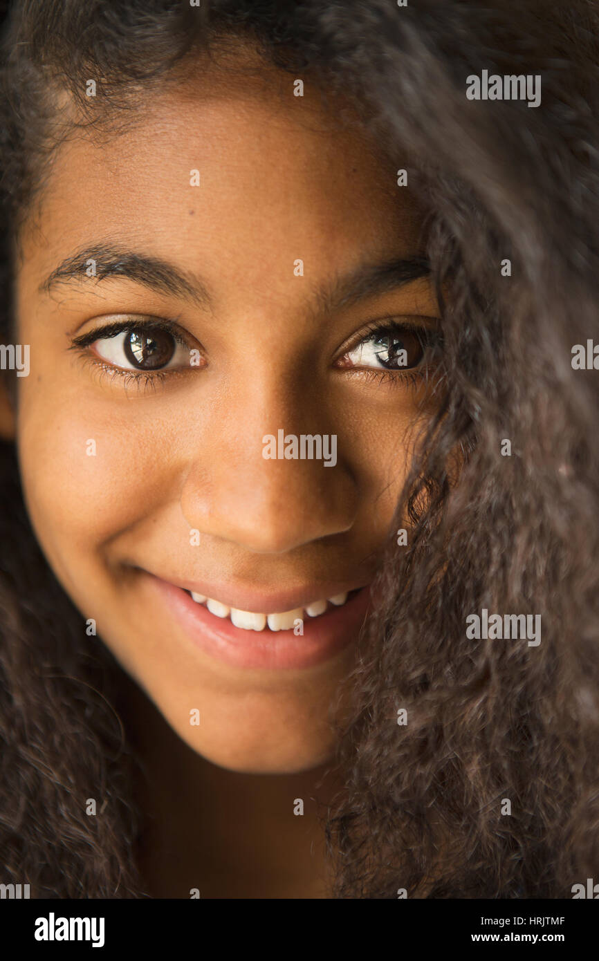 A young teenage girl smiling, portrait. Stock Photo