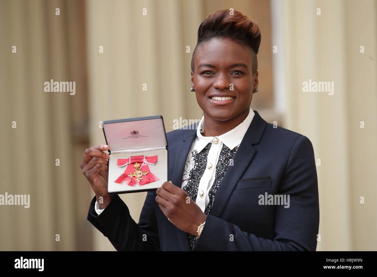 Olympic boxing champion Nicola Adams at Buckingham Palace in London after  receiving her OBE from the Duke of Cambridge Stock Photo - Alamy