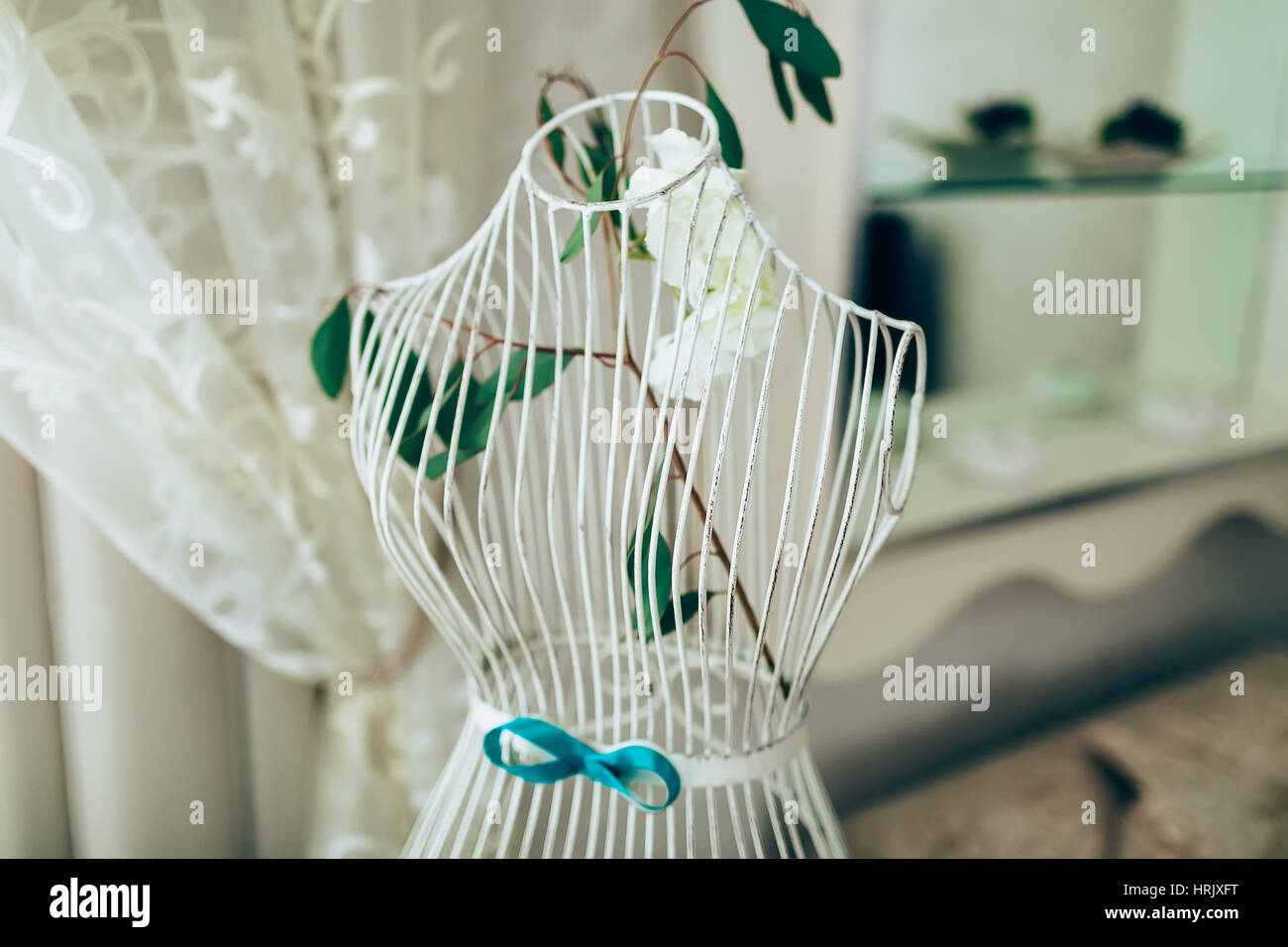 Vintage mannequin with flowers standung empty. Stock Photo