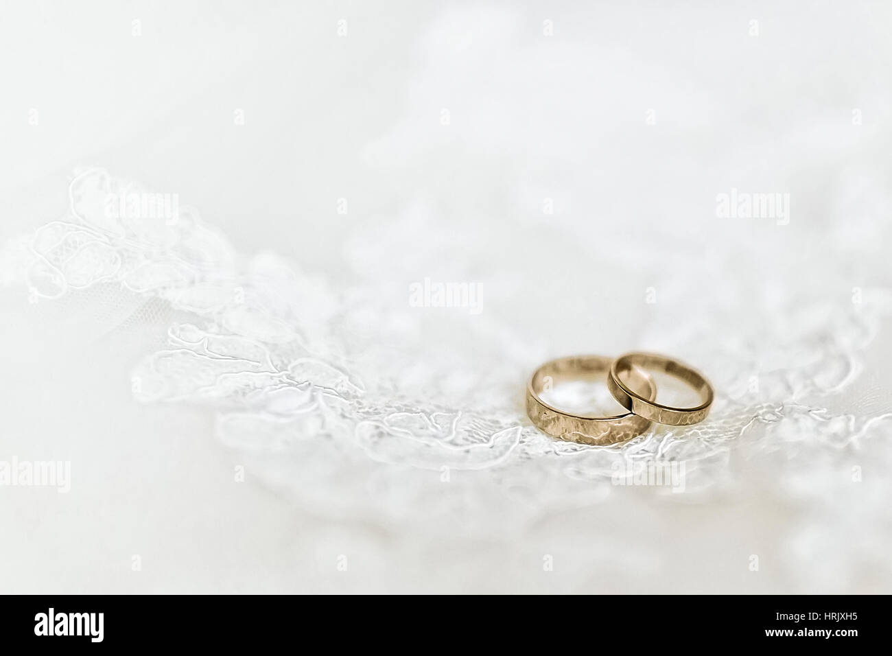 Wedding rings on wedding dress, close-up Stock Photo