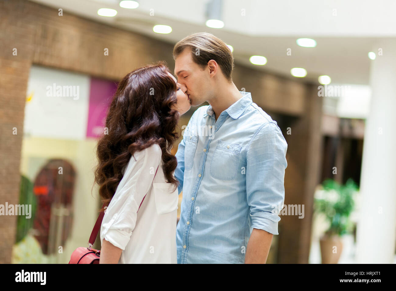 Young multiracial couple kissing hi-res stock photography and images ...