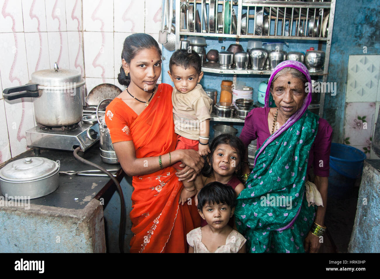 Poor,Family,in,basic,simple,kitchen,in,largest,slum,Dharavi,in,Asia